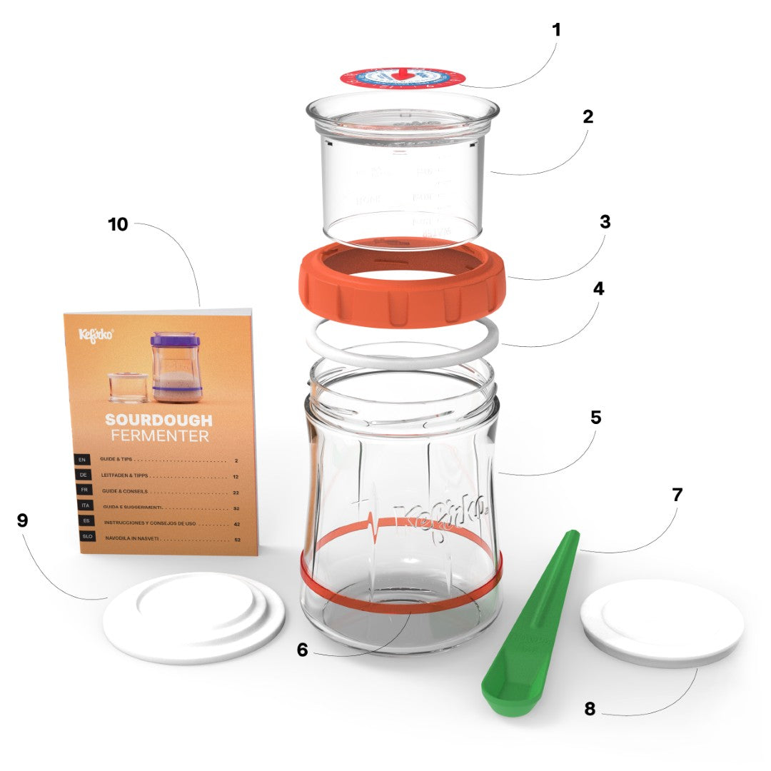 Vista despiezada del fermentador de masa madre Kefirko, mostrando el tarro, tapas, espátula y manual de instrucciones.